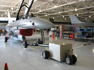 EVA HD9500 inside a hanger moving a f-16 Aircraft